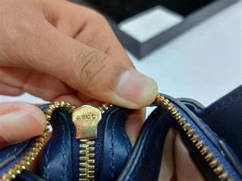 gucci fake vs real zippers